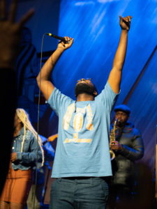 Obasi performing hands up